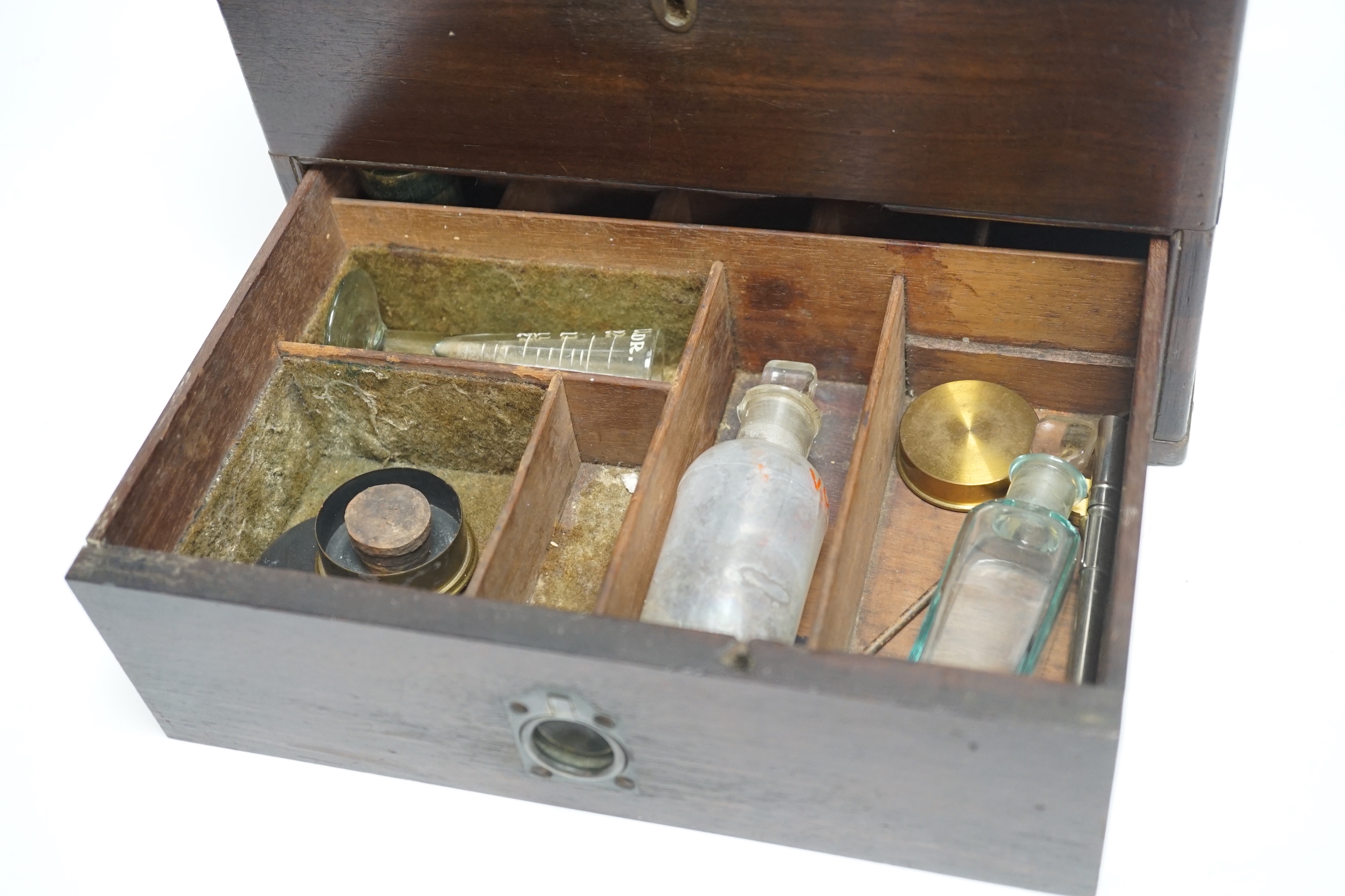 A 19th century mahogany apothecary box and contents, some bottles including Brighton labels, 23cm high x 25.5cm wide